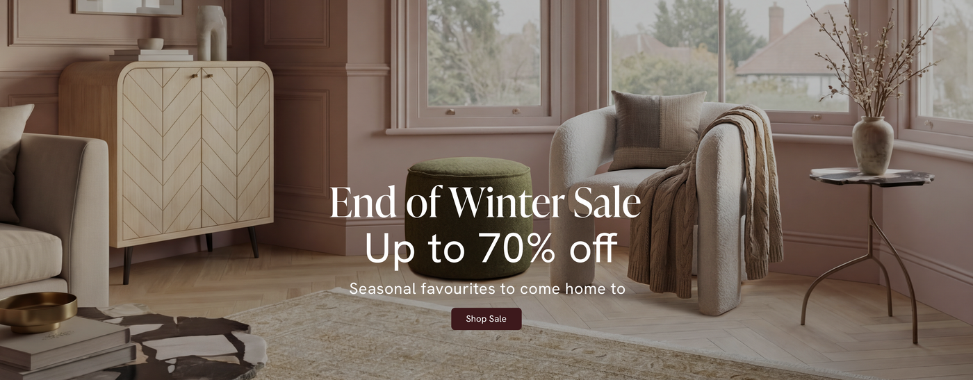Living room with furniture and decor, featuring an 'End of Winter Sale